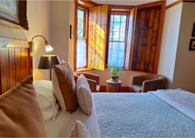 Oakdene Guest House Bedroom with 2 chairs in corner