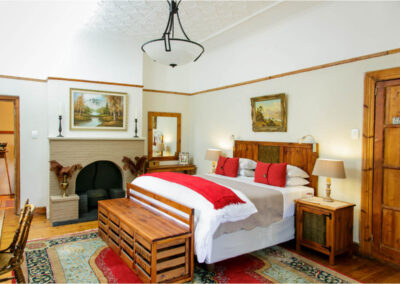 Oakdene Guest House bedroom with fireplace